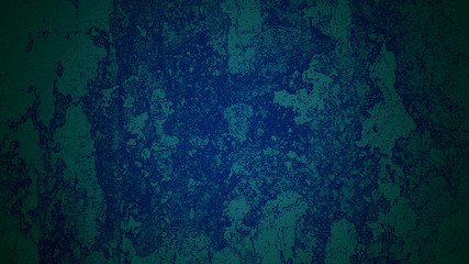 Blue shaded shabby wall under green light