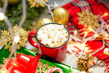 Christmas. Christmas background. Happy New Year. Holiday Red mug with hot chocolate white marshmallows and candy in the shape of a Christmas tree. Selective focus.