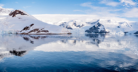 Fototapeta na wymiar Panorama of Neko Harbor and Lester Cove with glaciers and red tents on camp site, Arctowski Peninsula, mainland of Antarctica