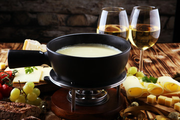 Gourmet Swiss fondue dinner on a winter evening with assorted cheese