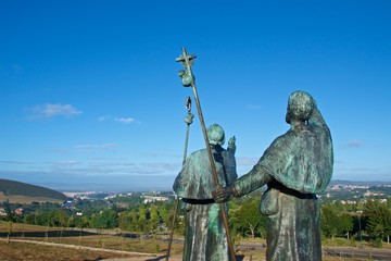 Statues of Pilgrims pointing the cathedral on Monte do Gozo in Santiago de Compostela, Spain