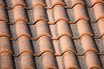 orange roof and blue sky background close up