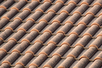 orange roof and blue sky background close up