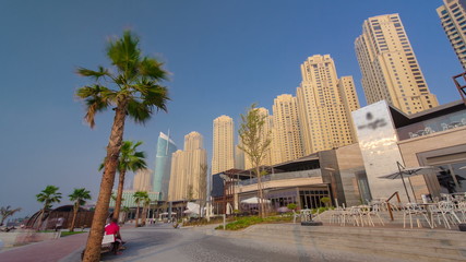 Fototapeta na wymiar Dubai Jumeirah Beach Residence Panorama with palms timelapse