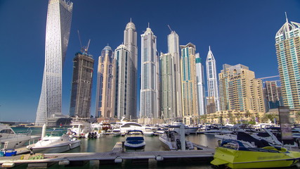 Obraz na płótnie Canvas Dubai Marina with skyscrapers and boats Hyperlapse