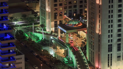 Fototapeta na wymiar Hotel entrance view in Dubai marina at night from top of skyscraper timelapse