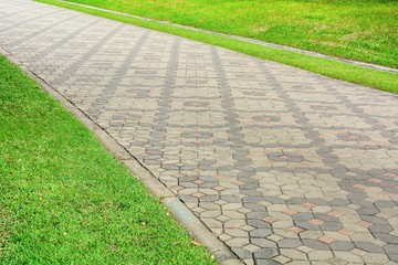 patterned paving tiles at walkway in the park