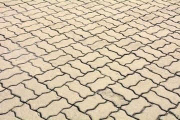 patterned paving tiles, old cement brick floor background