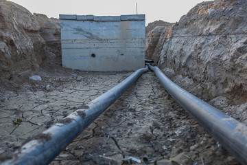 sewer pipes with water are laid underground