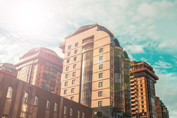 Fototapeta premium group of multi-storey residential buildings in bright light