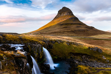 Iconic Kirkjufell Mountain and Waterfall in Iceland on an Autum Late Afternoon.