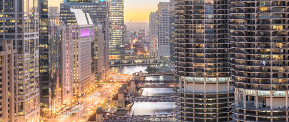 Panorama3 aerial view of skyline along Chicago river through downtown at sunset