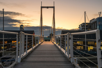 Narrow Modern Suspension Footbridge over a Harbour in Toronto, On, Canada, at Dusk