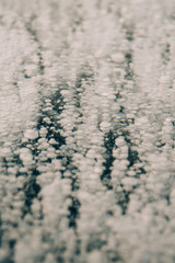 Natural background: air bubbles under the ice.