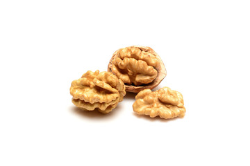 Walnut and kernels, one open walnut and two kernels close up macro, isolated on a white background.