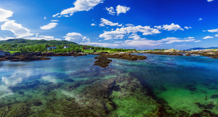 Picturesque panoramic view of Godoy Island in Giske Municipality in More og Romsdal county, Norway. Norwegian sea bay in summer scenery
