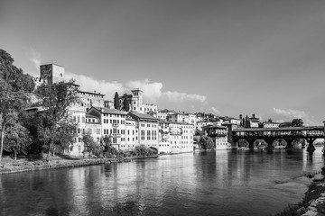 old wooden bridge spans the river brenta at the romantic village Basano del Grappa