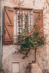 Typical window with wooden shutters in the Provencal style