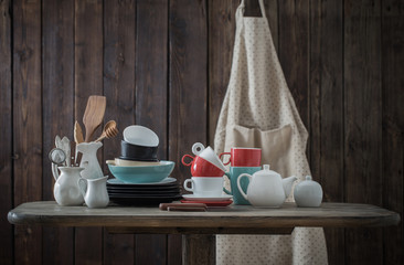 dinnerware on wooden background in kitchen