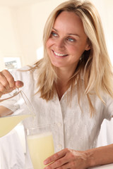 WOMAN POURING LEMONADE