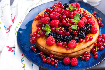 Sweet fruit cake with berries. Fresh berries raspberries and blueberries. FOR a family breakfast.