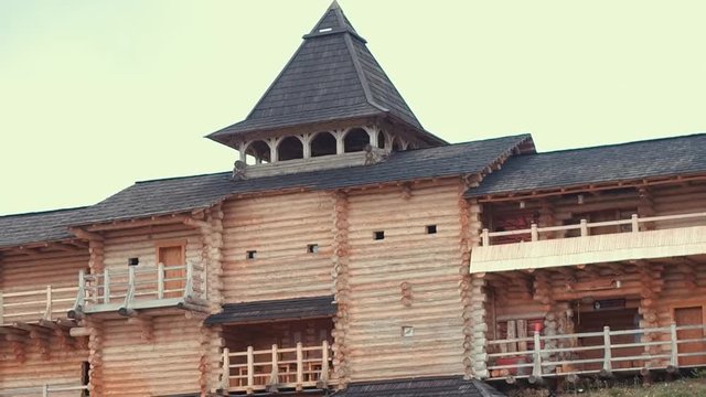 An ancient Slavic pagan city built of wood, excellent scenery for a historical film, old wooden churches and houses, an orthodox cross, summer time, no people in the frame, old Kiev