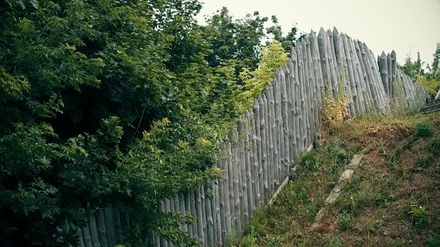 An ancient Slavic pagan city built of wood, excellent scenery for a historical film, old wooden churches and houses, an orthodox cross, summer time, no people in the frame, old Kiev