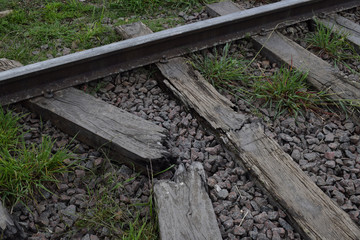 rails and sleepers, on the railway on broken sleepers are rails