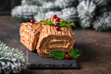Christmas yule log cake. Traditional chocolate dessert