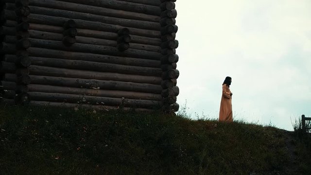 An ancient Slavic pagan city built of wood, excellent scenery for a historical film, old wooden churches and houses, an orthodox cross, summer time, no people in the frame, old Kiev