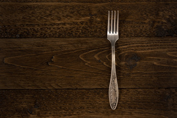 Old cutlery. Top view On a wooden background, Copy space.