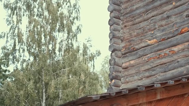 An ancient Slavic pagan city built of wood, excellent scenery for a historical film, old wooden churches and houses, an orthodox cross, summer time, no people in the frame, old Kiev