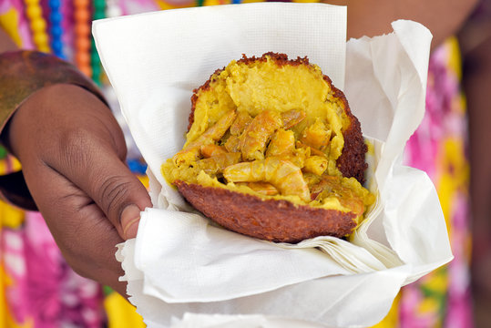 Brazilian food: acaraje on the hand of the baiana