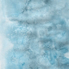 Blue watercolor winter texture with abstract washes and brush strokes on the white paper background.