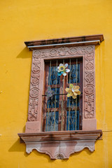 Window with wrought iron and flowers