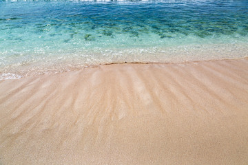 Fototapeta na wymiar A Sandy Beach and the Caribbean Sea