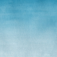 Blue watercolor winter texture with abstract washes and brush strokes on the white paper background.