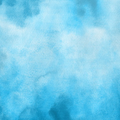 Blue watercolor winter texture with abstract washes and brush strokes on the white paper background.