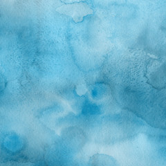Blue watercolor winter texture with abstract washes and brush strokes on the white paper background.