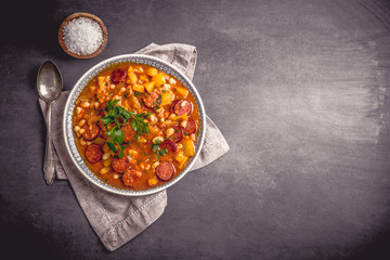Stew with cabanossi peppers and beans