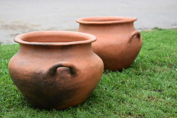 two clay pots in the street