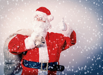 Funny Santa Claus with sack on white background