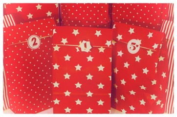 Door of an advent calendar with 24 parcels in red with in german Frohe Weihnachten 2018 in english Merry Chrstmas 2018