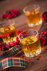 Whiskey, brandy or liquor shot and Christmas decorations