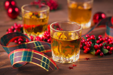 Whiskey, brandy or liquor shot and Christmas decorations