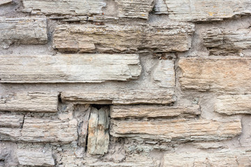 Old weathered brick wall of medieval fortress, horizontal grunge background