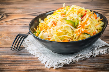 Salad appetizer of fermented vegetables sauerkraut carrots and peppers