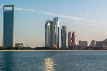 Fototapeta na wymiar Beautiful view of Abu Dhabi city beach, towers and buildings