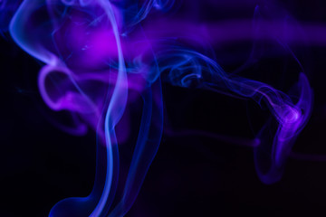 Colorful smoke close-up on a black background