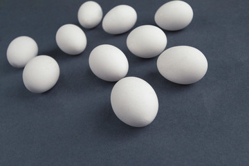 group of white eggs on grey